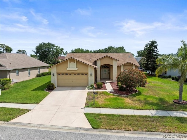 18514 Hidden Pines Way, Hudson, FL 34667 - view of front of property featuring a garage, concrete driveway, a front yard, and stucco siding