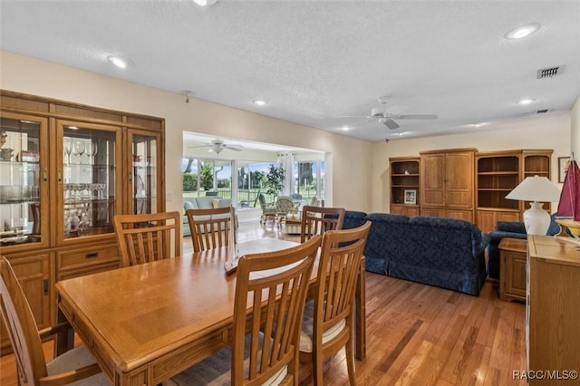 839 N Foxrun Ter, Inverness, FL 34453 - dining area featuring ceiling fan, light wood finished floors, a textured ceiling, and recessed lighting