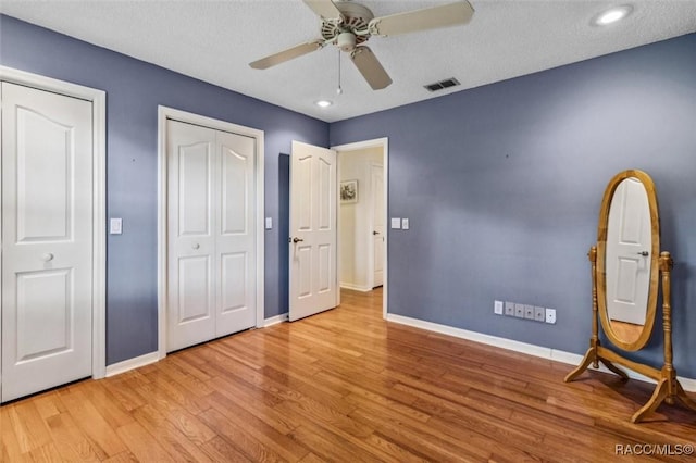 839 N Foxrun Ter, Inverness, FL 34453 - unfurnished bedroom featuring wood finished floors, recessed lighting, and a ceiling fan