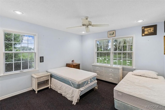 839 N Foxrun Ter, Inverness, FL 34453 - bedroom featuring dark carpet, recessed lighting, ceiling fan, and a textured ceiling