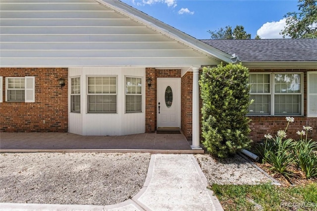 839 N Foxrun Ter, Inverness, FL 34453 - entrance to property featuring brick siding and roof with shingles