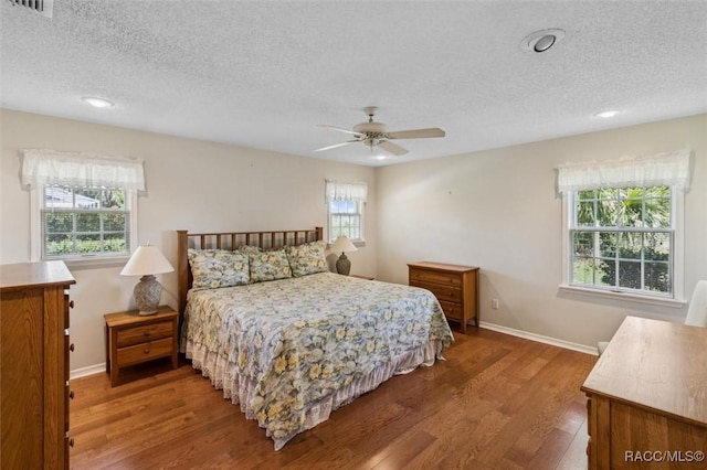 839 N Foxrun Ter, Inverness, FL 34453 - bedroom featuring a textured ceiling, wood finished floors, a ceiling fan, and recessed lighting