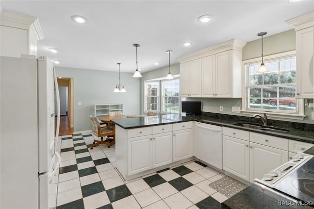 839 N Foxrun Ter, Inverness, FL 34453 - kitchen featuring white appliances, a peninsula, hanging light fixtures, white cabinetry, and recessed lighting