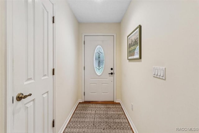 839 N Foxrun Ter, Inverness, FL 34453 - doorway to outside featuring baseboards