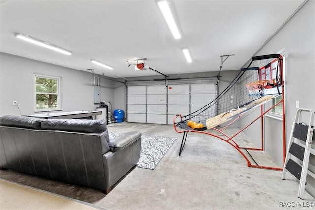 garage featuring electric panel and a garage door opener