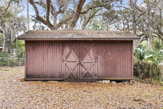 view of shed with fence