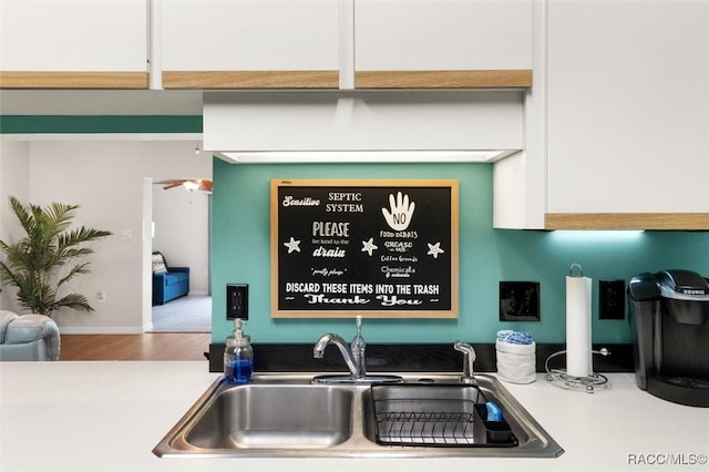 interior details with wood finished floors and a sink