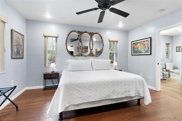 bedroom featuring ceiling fan, baseboards, and wood finished floors