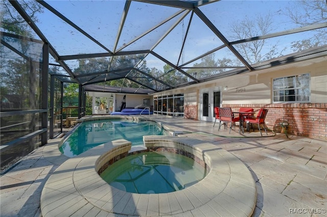 4275 E Riverside Dr, Dunnellon, FL 34434 - view of pool featuring a patio, french doors, a pool with connected hot tub, and glass enclosure