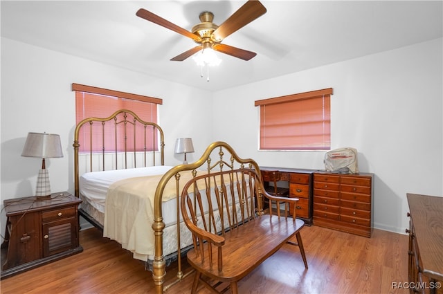 bedroom featuring ceiling fan and wood-type flooring