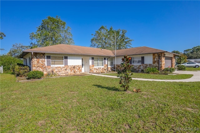 ranch-style home with a front lawn