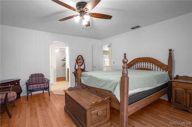 bedroom with ceiling fan and light wood-type flooring