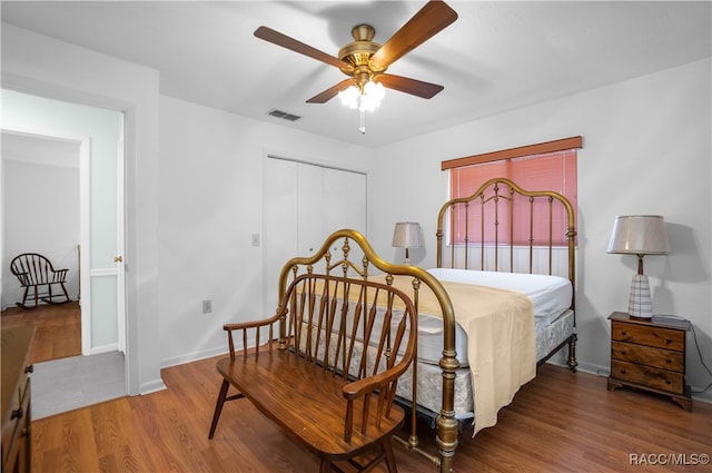 bedroom featuring hardwood / wood-style flooring and ceiling fan