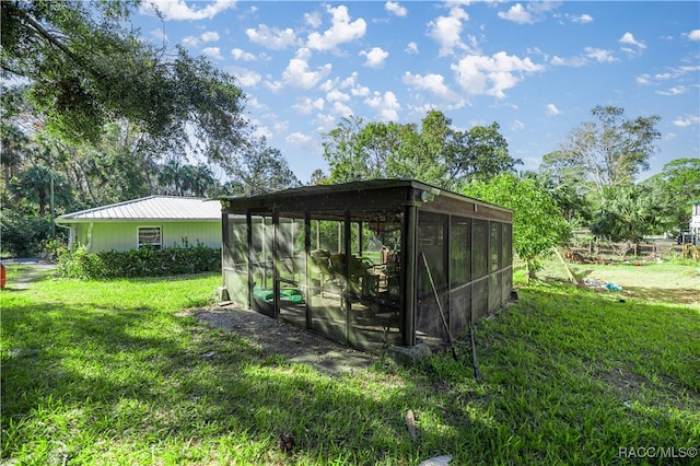 view of outbuilding featuring a yard