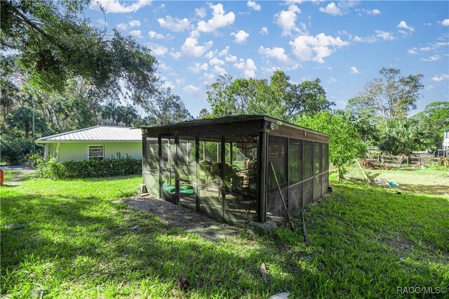25 64th St, Yankeetown, FL 34498 - view of outdoor structure with a sunroom