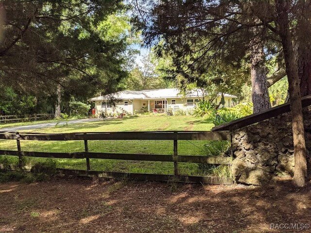 view of home's exterior with a yard