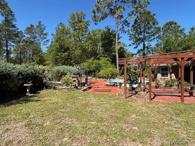 view of yard with a patio and a pergola