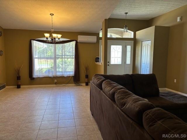 living room featuring light tile patterned floors, a wall unit AC, vaulted ceiling, a notable chandelier, and baseboards