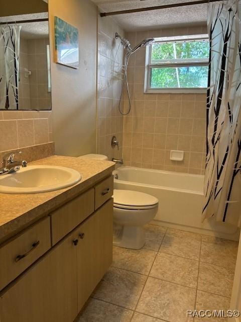 bathroom featuring shower / bath combo, tile patterned flooring, toilet, and vanity
