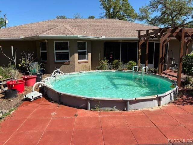 outdoor pool with a patio