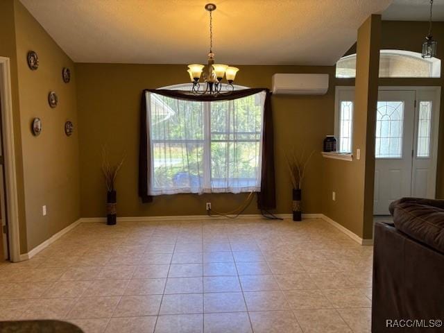 unfurnished dining area featuring baseboards, light tile patterned flooring, an inviting chandelier, and a wall mounted air conditioner