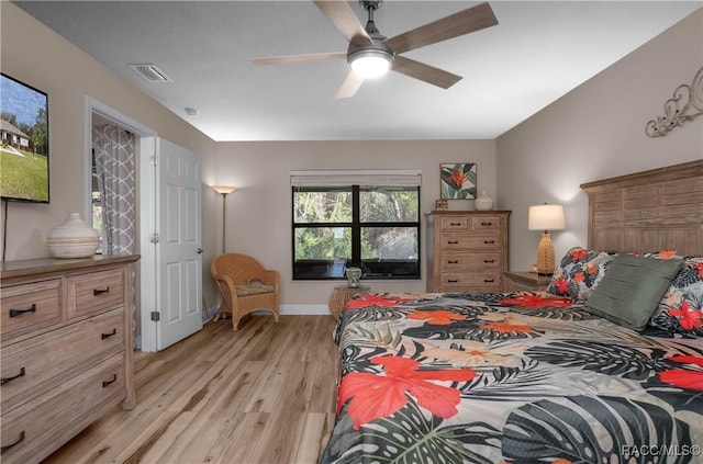 bedroom featuring ceiling fan and light hardwood / wood-style floors