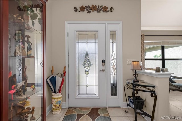 foyer entrance featuring light tile patterned floors