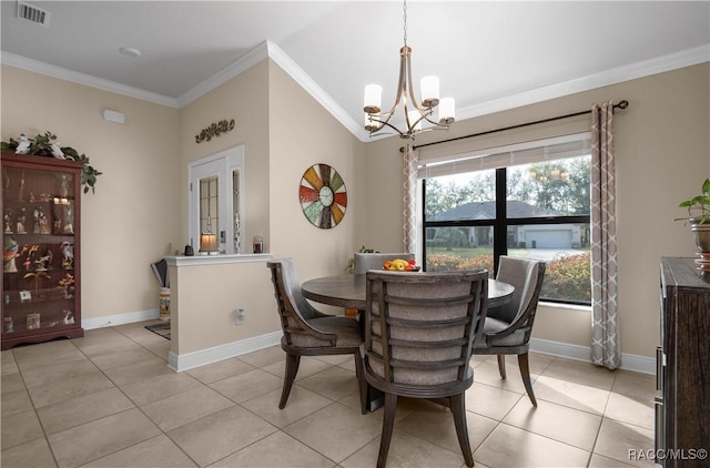 dining space featuring crown molding, light tile patterned flooring, and a chandelier