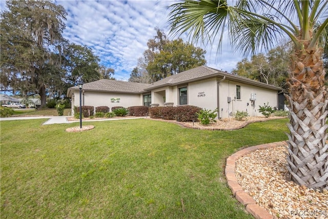 view of front of home with a front lawn