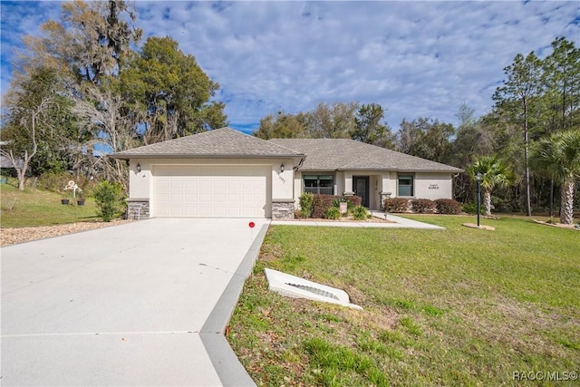 single story home with a garage and a front lawn