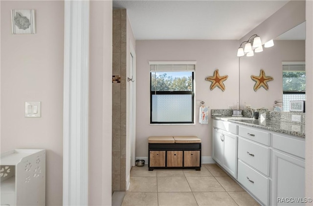 bathroom featuring tile patterned flooring and vanity