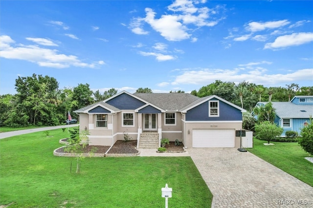 ranch-style home featuring a garage and a front yard