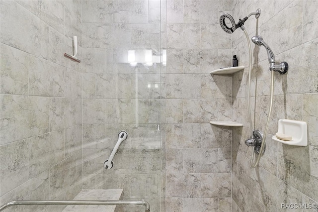 bathroom with a tile shower