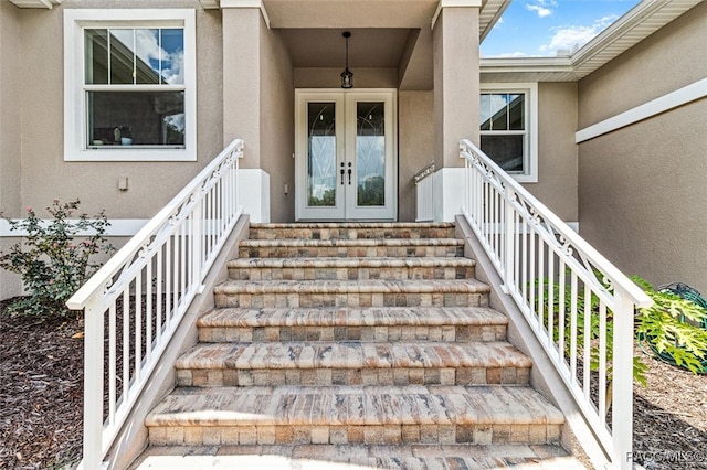 property entrance featuring french doors