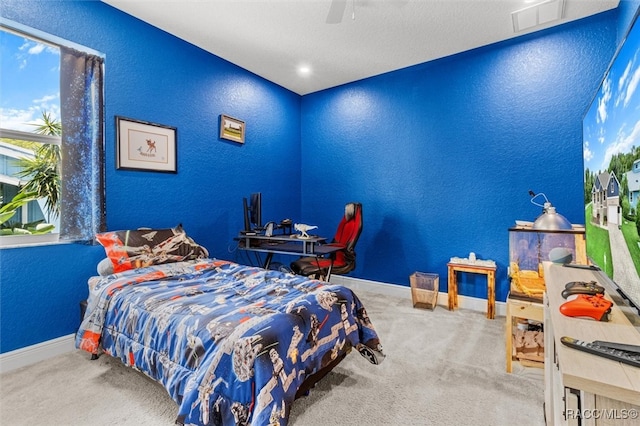 carpeted bedroom with ceiling fan