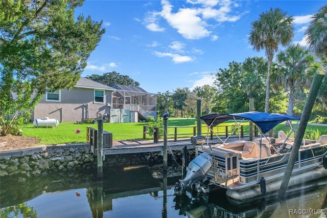 dock area with a water view and a lawn