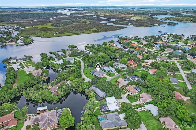 birds eye view of property featuring a water view