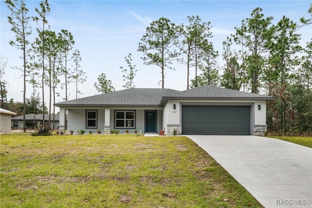 view of front of home with a garage and a front yard