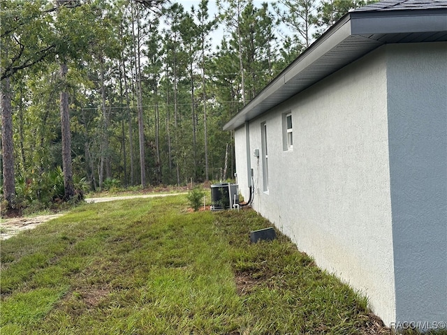 view of yard with central AC unit