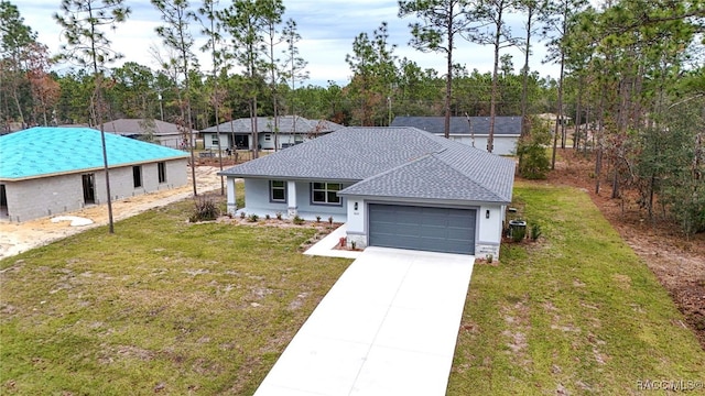 single story home featuring a front lawn and a garage