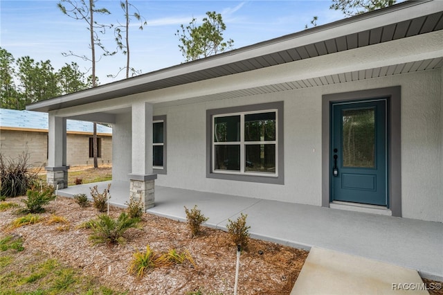 property entrance with covered porch