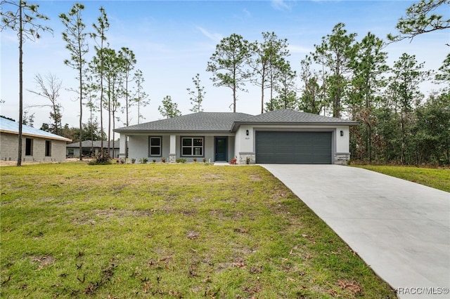 ranch-style house featuring a front yard and a garage