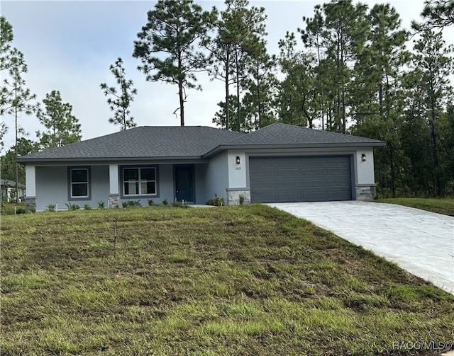 ranch-style house featuring a garage and a front lawn