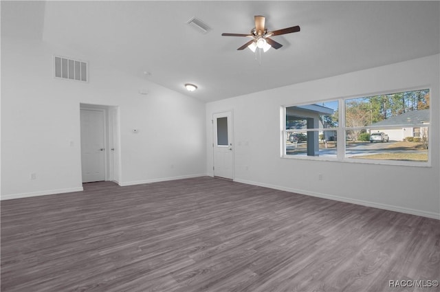 empty room with lofted ceiling, dark wood-type flooring, and ceiling fan