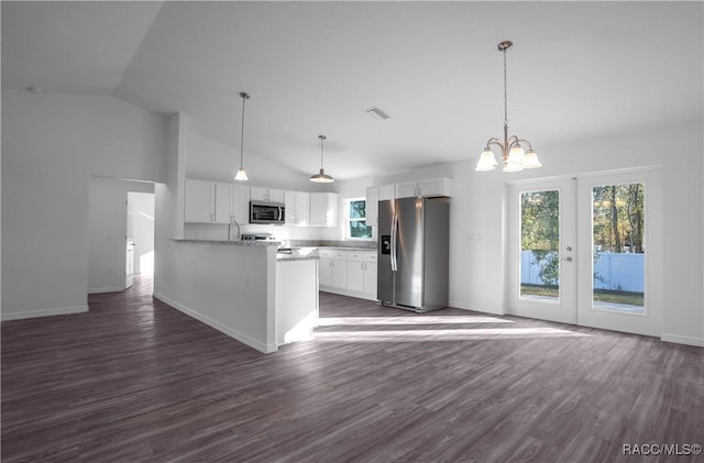 kitchen featuring dark hardwood / wood-style flooring, kitchen peninsula, pendant lighting, stainless steel appliances, and white cabinets