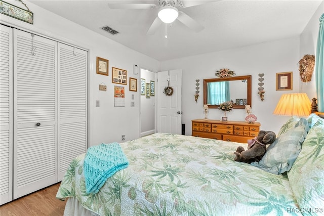 bedroom with ceiling fan, a closet, and light wood-type flooring