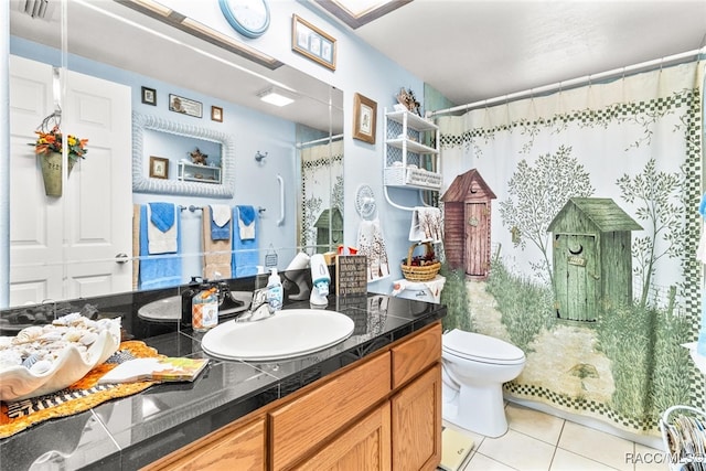 bathroom with tile patterned flooring, vanity, toilet, and a shower with shower curtain