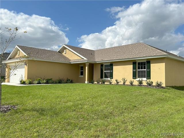 ranch-style home with a garage and a front yard