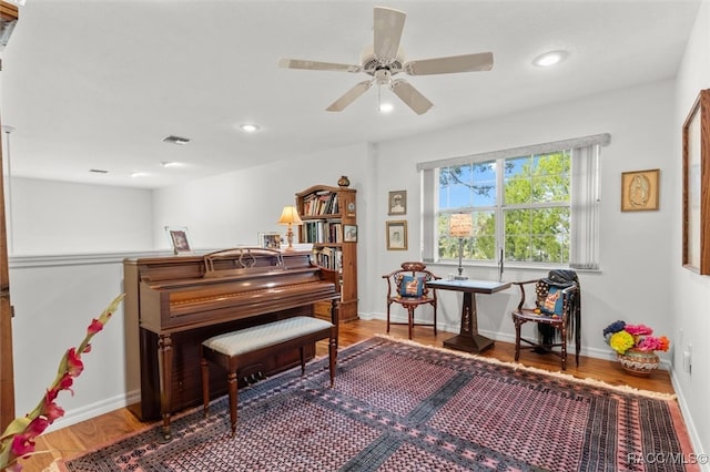 miscellaneous room featuring hardwood / wood-style flooring and ceiling fan