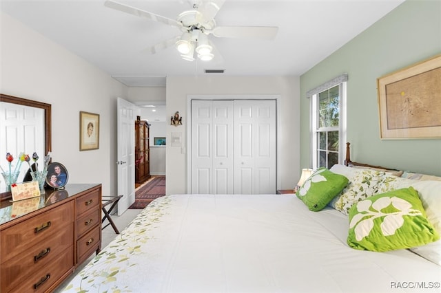 bedroom featuring ceiling fan and a closet